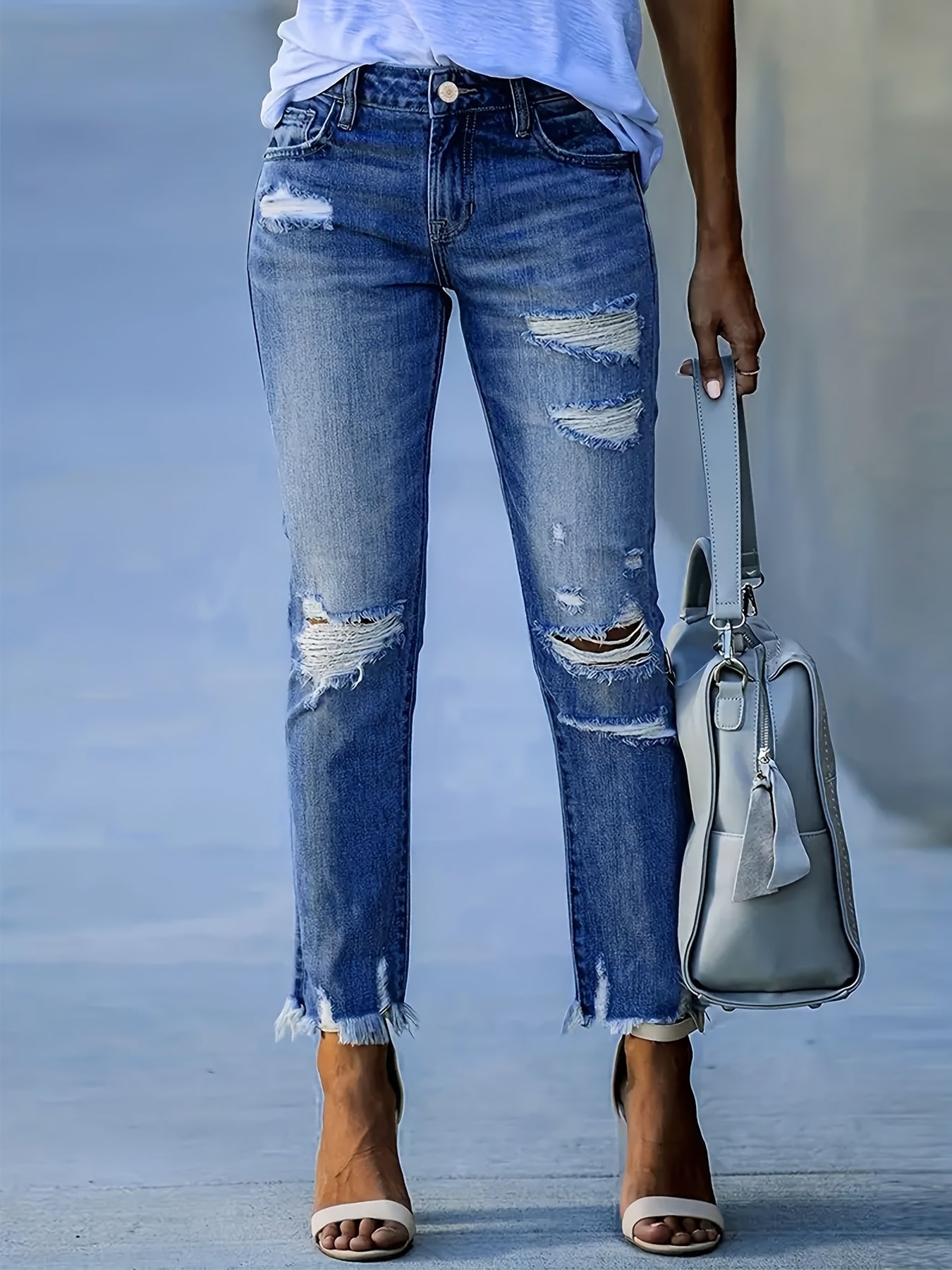 Dames skinny denim jeans met gescheurde details