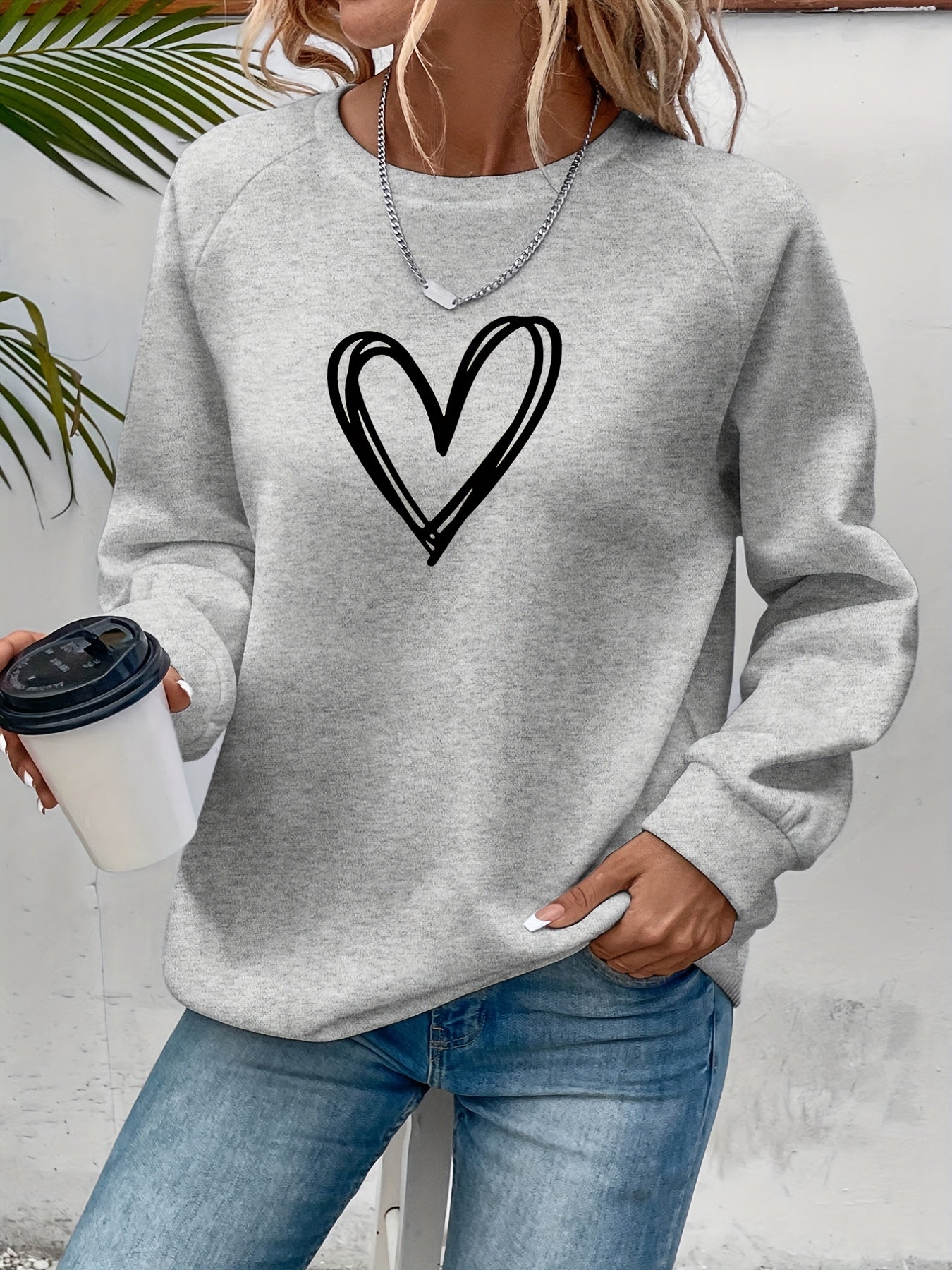 Dames oversized trui met hartjesprint