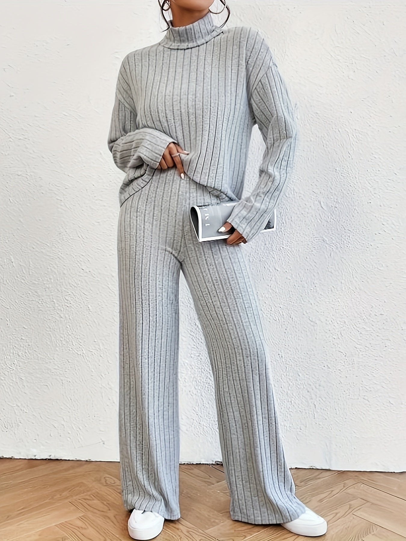 Dames comfortabele set met turtleneck bovenkant en flared broek